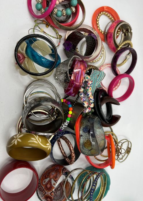 Two bags of vintage and contemporary bangles and b