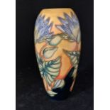 A modern Moorcroft Blue lilac pattern baluster Trial vase, impressed marks and "Blue lilac" Trial