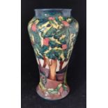 A modern Moorcroft "Holly Hatch" pattern baluster vase, impressed marks and WM and c97 in script,