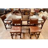 A 17th century revival oak refectory table, two plank top with cleated ends, raised on carved