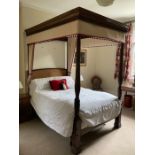 A Victorian mahogany four poster bed.  Note: no mattress, duvet, no headboard