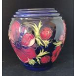 A modern Moorcroft anenome pattern baluster vase, blue ground, impressed marks and WM 10/5/99 in