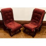 A pair of Victorian ebonized slipper chairs upholstered and with gilt metal mounts