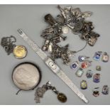 A Sterling silver charm bracelet (gross weight approximately 92.4 grams), containing more than 30