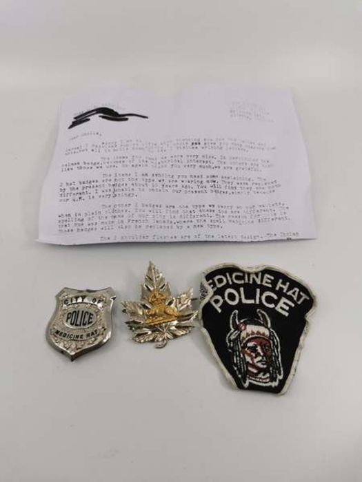 Three "Medicine Hat" Canadian police badges. Comprising a fabric patch. a maple leaf hat badge and a