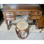 A 20th century oak kneehole desk; another bentwood bergere stool. (2)