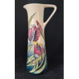 A modern Moorcroft pottery Iris pattern jug designed by Rachel Bishop, impressed marks and script