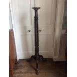 A 19th Century mahogany torchere, probably incorporating earlier timbers