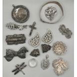 A selection of antique and vintage white metal jewellery comprising three marcasite set brooches;