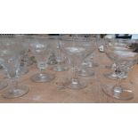 A collection of cut glass 20thC stemmed sherry, wine and shot glass, some etched as shown (33)