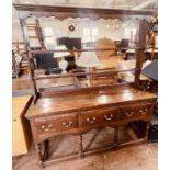 A George III and later oak dresser, moulded cornice above a two tier plate rack, on a sideboard base