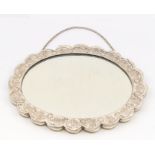 A Turkish 900 standard silver shaped oval mirror, semi-elliptical border engraved decoration, the