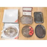 A collection of silver plated items including boxed unused trays wine labels etc