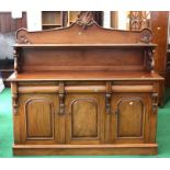 A large Victorian mahogany sideboard with pierced gallery top, three top drawers above three