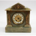 An onyx mantle clock with gilt detailing