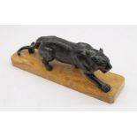 An Art Deco panther on marble stand