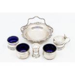 A collection of silver to include; a Birmingham silver trio of pepper pot, mustard pot and condiment