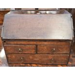 An 18th century oak writing box - stand missing - with a drop-down front above two single drawers