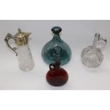 A collection of glass decanters, including Georgian, Continental, coloured and clear, and a claret