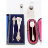 A collection of silver items to include a cased George V silver button hook and shoe horn set,