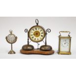 A presentation carriage clock with military related inscription, brass sphere shaped hanging clock