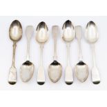 Seven various early 19th Century silver fiddle pattern dessert spoons, London, various dates and