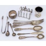 A collection of silver to include: a Birmingham silver four slot toast rack, a Birmingham silver