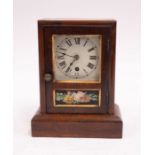 A Seth Thomas small clock with floral and gold paint decoration, pendulum and key present.