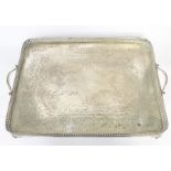 A large Victorian two handled rectangular electro plated tray, gallery rim on scroll feet, stamped