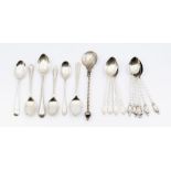A collection of silver teaspoons, various designs including six Apostle with twist handles,