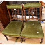 A pair of late Victorian parlour chairs with green velvet upholstery