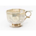 An Arts & Crafts Britannia silver mug / cup, octagonal body with geometric handle and plain