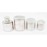 A collection of three matching silver travelling boxes, with gilt interiors, two pop tops other