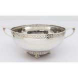 Albert Edward Jones - An Arts and Crafts silver twin handled bowl, with planished finish and on