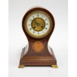 An Edwardian mahogany 8-day balloon mantel clock with batwing inlay and Roman numerals,