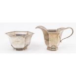 A 1930s Art Deco period hexagonal silver sugar bowl and matching milk jug, hallmarked by Josiah