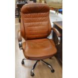 A modern brown leather and chrome office chair