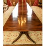 ***WITHDRAWN*** A Regency four pillar mahogany dining table, with three extending leaves and brass