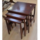 A dark mahogany 1980's nest of three tables