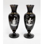 Two Late In the manner of Mary Gregory 19th century black glass vases with painted enamel detail and