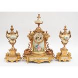 A late 19th century gilt spelter French mantel clock with garnitures