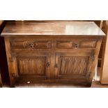 A 20th century oak sideboard. 77cm H x 112cm W x 4