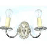 A set of four matching silver plated wall lights,
