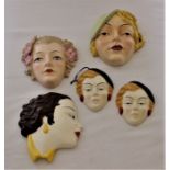 A Beswick wall mounting mask of a 1930's lady, printed marks, three Moorland pottery examples and