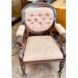 A Victorian mahogany open armchair, spoon back rest, later button back upholstery, arm rest on