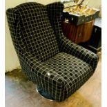 Andrew Martin fabric swivel armchair on a chrome base