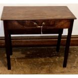A George III mahogany folding tea table with rectangular top, frieze drawer on channelled square