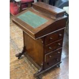 A Victorian mahogany davenport desk, lifting leather inlay writing slope, enclosing storage space,