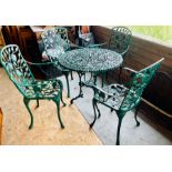 Cast metal garden furniture, a circular table and chairs. (5)