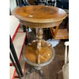 two round wooden side tables